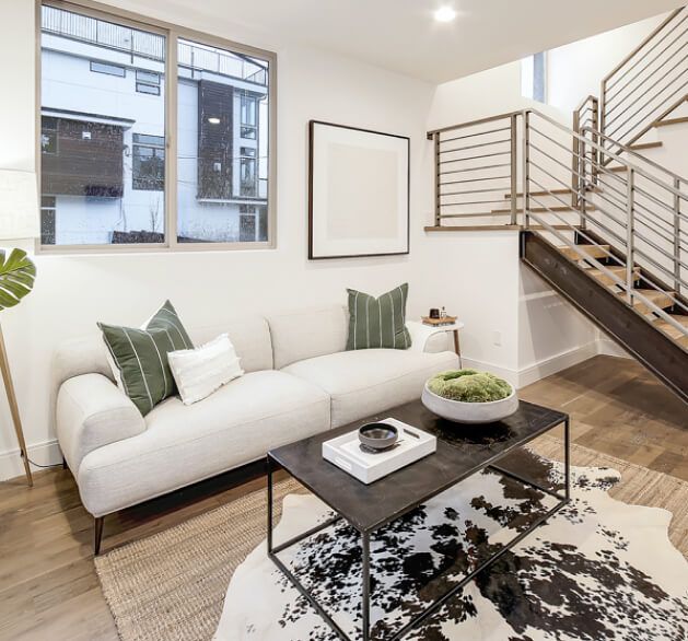 Living room with open stair in a Bungalow Building home