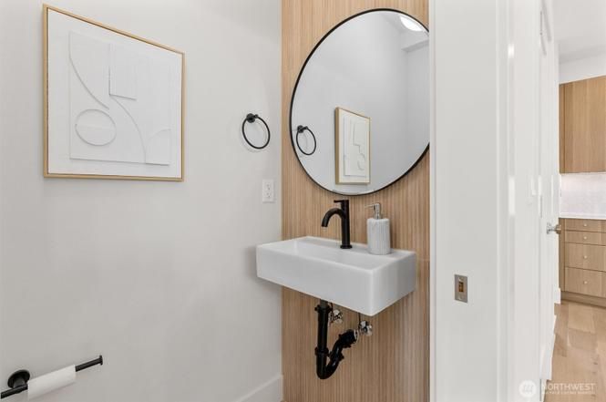 Powder room with round mirror