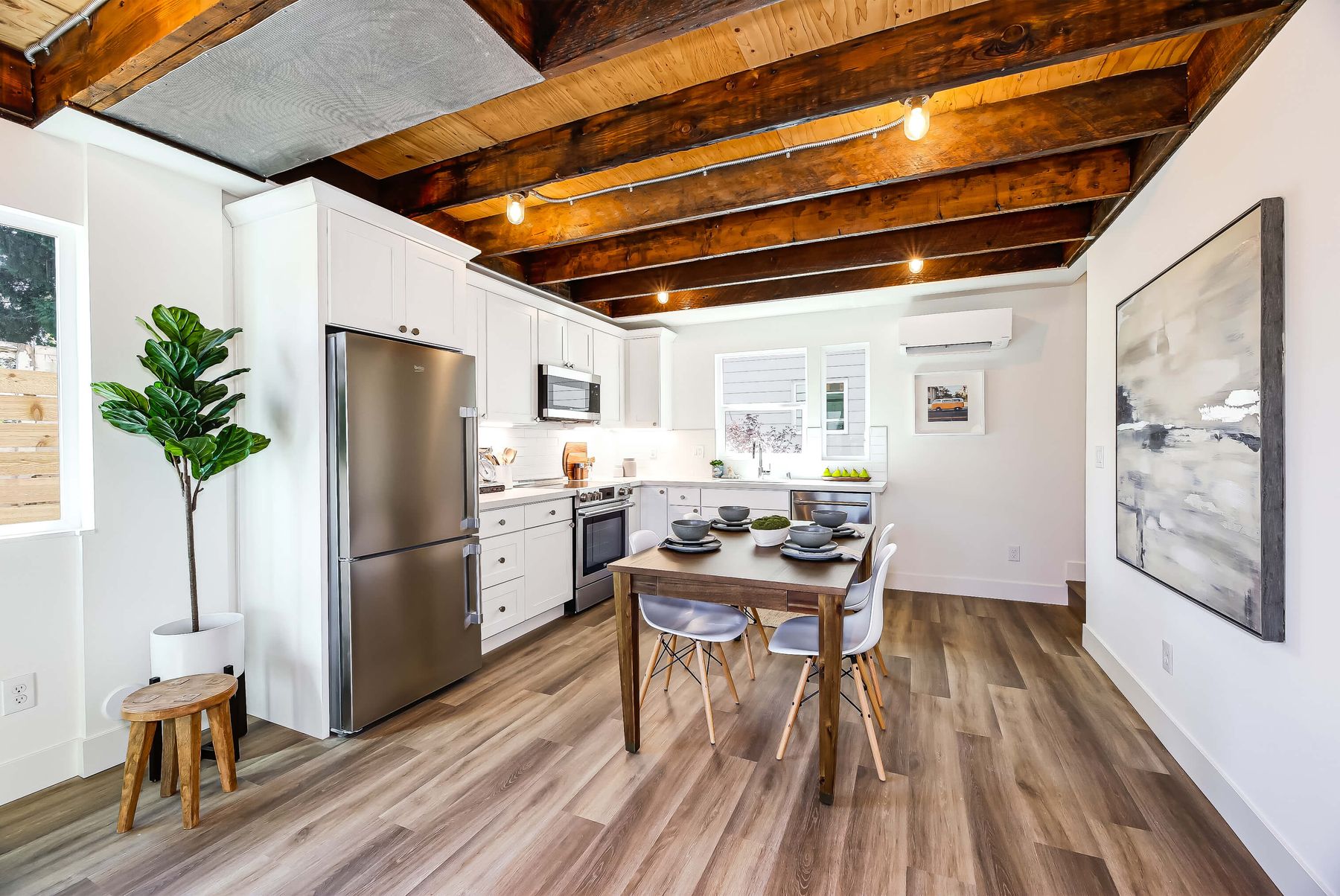 Kitchen and dining under reclaimed timber beams