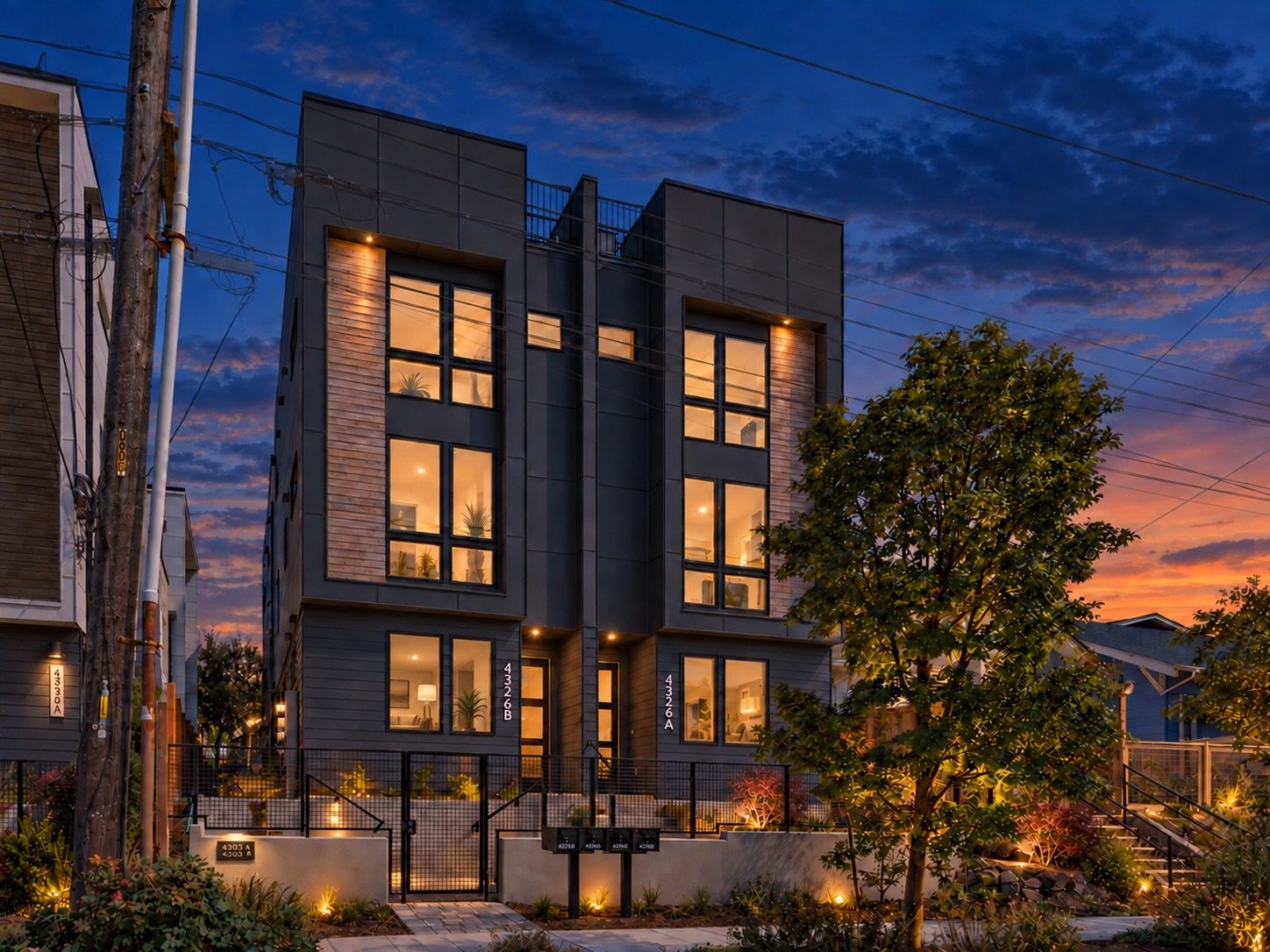 Bungalow Townhomes townhomes lit up at dusk