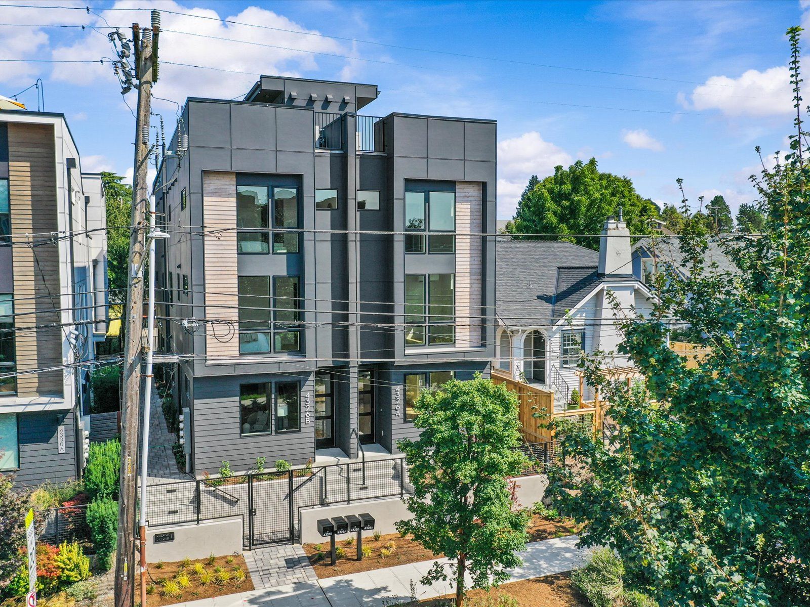 Bungalow Townhomes townhomes from Woodlawn Ave N, with rooftop decks and cedar accents